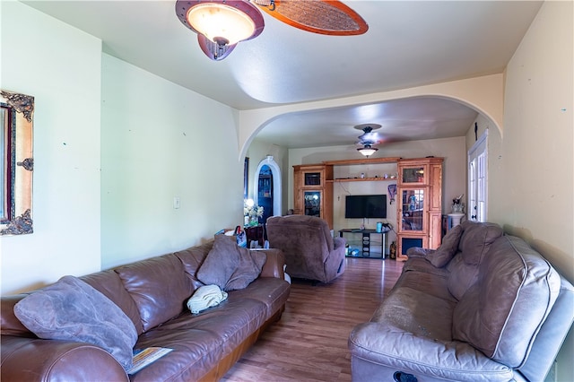 living room featuring hardwood / wood-style flooring and ceiling fan