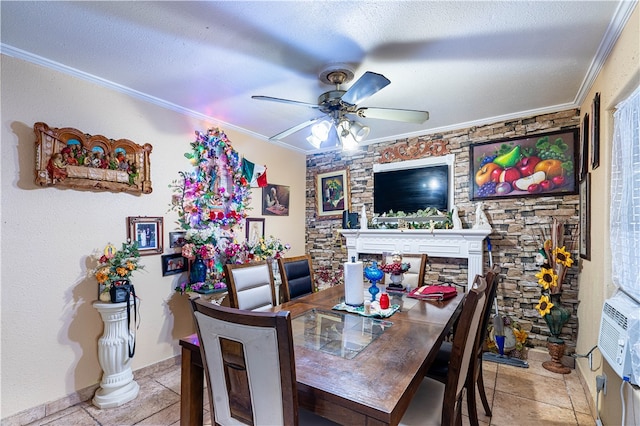 tiled dining room featuring ceiling fan, a textured ceiling, and ornamental molding