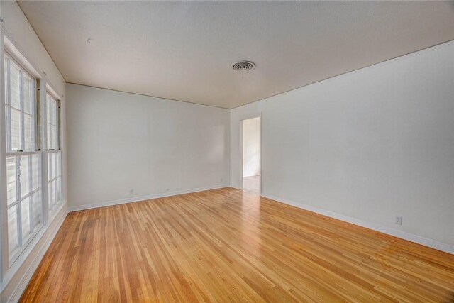 3730 Fort Worth St, Corpus Christi, TX 78411 - spare room featuring light wood-style flooring and baseboards