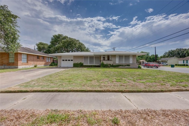 3730 Fort Worth St, Corpus Christi, TX 78411 - single story home featuring a garage, concrete driveway, a front lawn, and brick siding