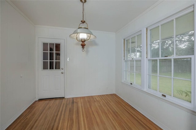 3730 Fort Worth St, Corpus Christi, TX 78411 - unfurnished dining area featuring wood finished floors, ornamental molding, and baseboards