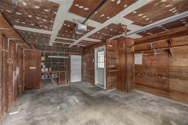 3730 Fort Worth St, Corpus Christi, TX 78411 - garage with a garage door opener and wooden walls