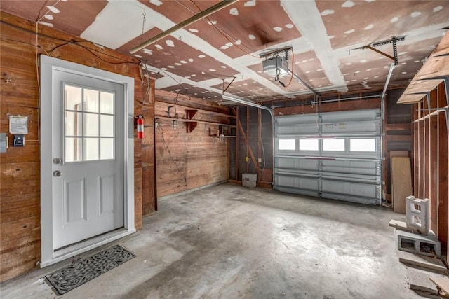 3730 Fort Worth St, Corpus Christi, TX 78411 - garage featuring wood walls and a garage door opener
