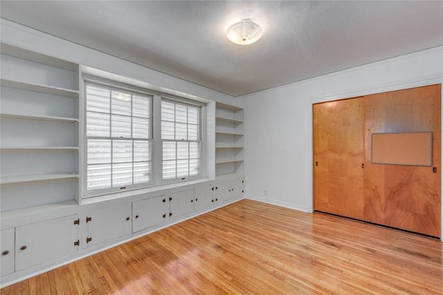 3730 Fort Worth St, Corpus Christi, TX 78411 - spare room with light wood-style floors, baseboards, and built in shelves