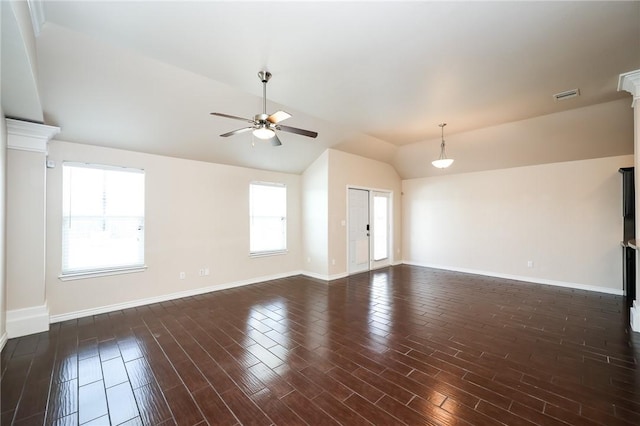 spare room with dark wood-type flooring, lofted ceiling, visible vents, and a ceiling fan