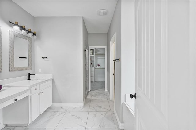 4122 Nadia Dr, Corpus Christi, TX 78414 - full bath featuring a walk in closet, baseboards, a tub, marble finish floor, and vanity