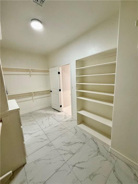 4122 Nadia Dr, Corpus Christi, TX 78414 - hall with visible vents, marble finish floor, and baseboards