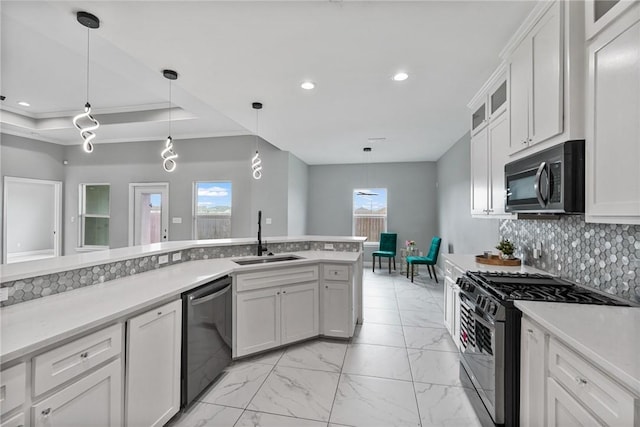 4122 Nadia Dr, Corpus Christi, TX 78414 - kitchen featuring decorative light fixtures, a sink, dishwashing machine, stainless steel range with gas cooktop, and light countertops