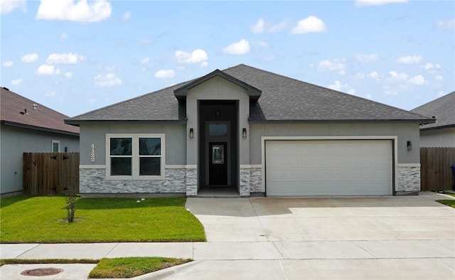 4122 Nadia Dr, Corpus Christi, TX 78414 - view of front facade featuring fence, stucco siding, stone siding, and concrete driveway