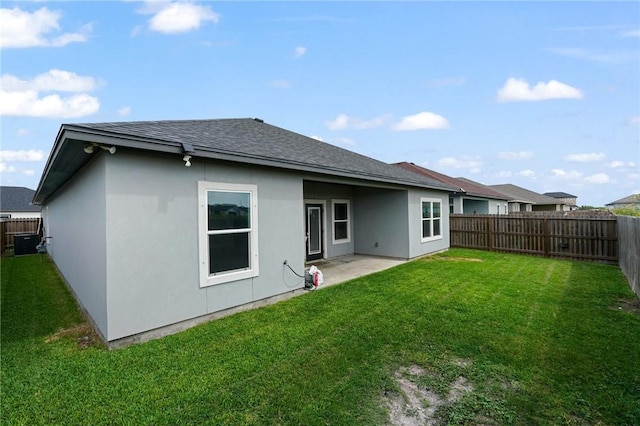 4122 Nadia Dr, Corpus Christi, TX 78414 - rear view of house with a fenced backyard, stucco siding, central air condition unit, and a yard