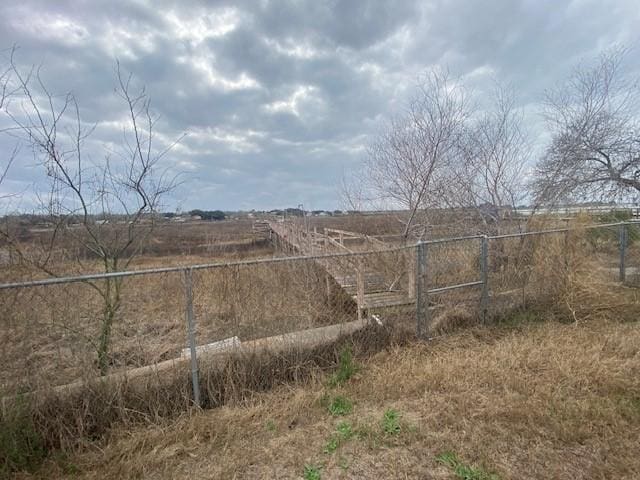 view of yard with a rural view