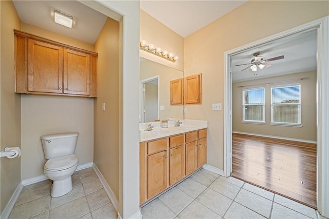 5909 Sutherland Dr, Corpus Christi, TX 78414 - bathroom featuring tile patterned floors, double vanity, and ceiling fan
