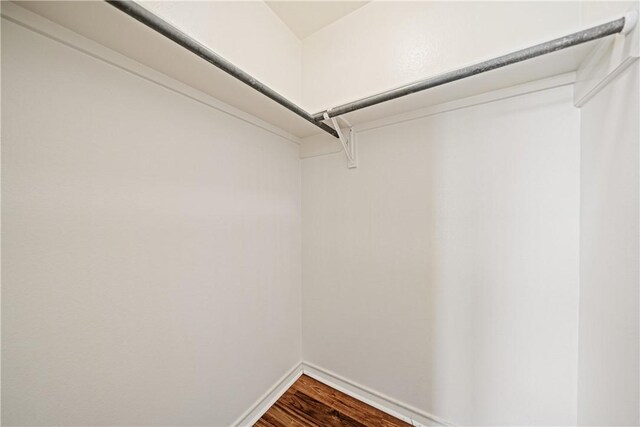 5909 Sutherland Dr, Corpus Christi, TX 78414 - walk in closet featuring dark wood-type flooring