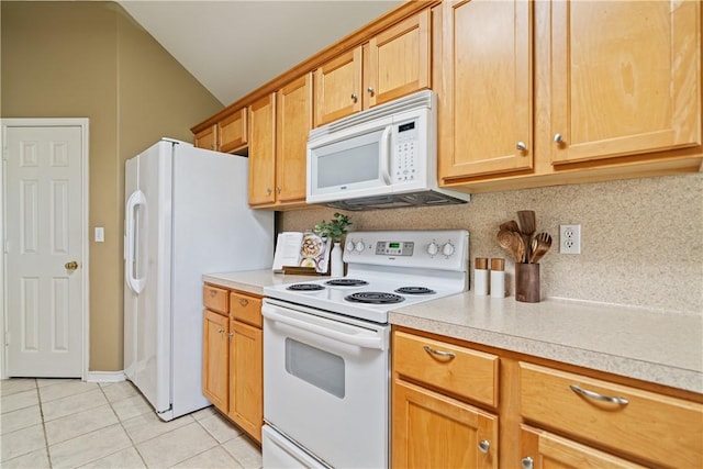 5909 Sutherland Dr, Corpus Christi, TX 78414 - kitchen with white appliances, light countertops, light tile patterned flooring, vaulted ceiling, and decorative backsplash