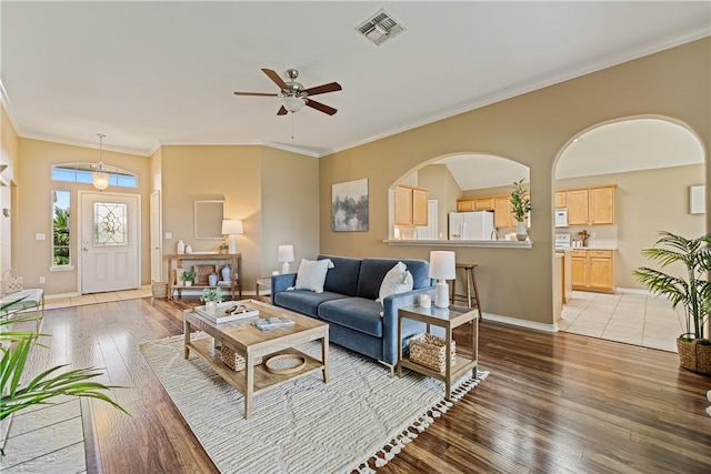 5909 Sutherland Dr, Corpus Christi, TX 78414 - living area with a ceiling fan, light wood finished floors, and crown molding