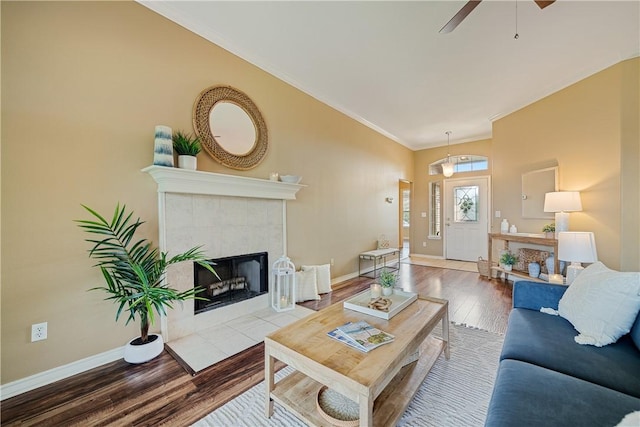 5909 Sutherland Dr, Corpus Christi, TX 78414 - living area featuring wood finished floors, ornamental molding, ceiling fan, and a fireplace