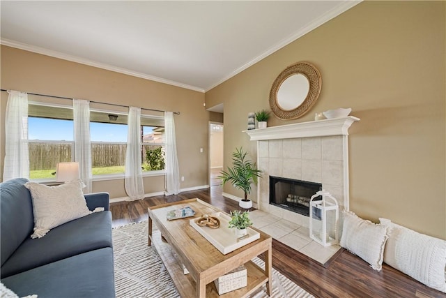 5909 Sutherland Dr, Corpus Christi, TX 78414 - living room featuring ornamental molding, a fireplace, and wood finished floors