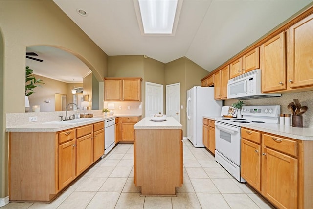 5909 Sutherland Dr, Corpus Christi, TX 78414 - kitchen featuring white appliances, a kitchen island, light countertops, a peninsula, and vaulted ceiling