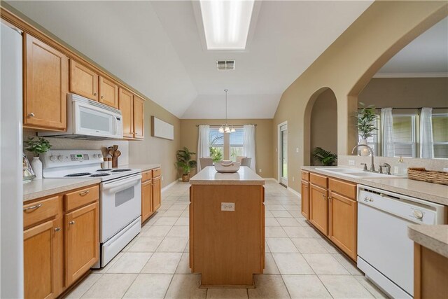 5909 Sutherland Dr, Corpus Christi, TX 78414 - kitchen featuring white appliances, a kitchen island, light countertops, arched walkways, and pendant lighting