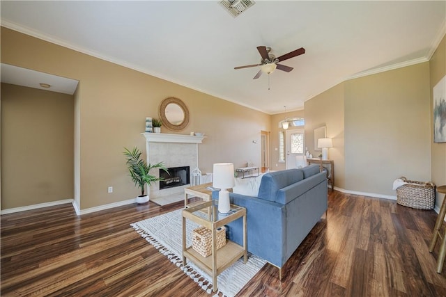 5909 Sutherland Dr, Corpus Christi, TX 78414 - living room with wood finished floors, ceiling fan, a tiled fireplace, and ornamental molding