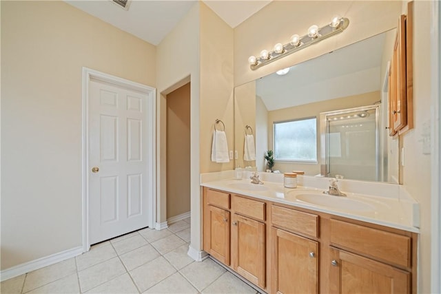 5909 Sutherland Dr, Corpus Christi, TX 78414 - bathroom with double vanity, tile patterned flooring, and a shower with shower door