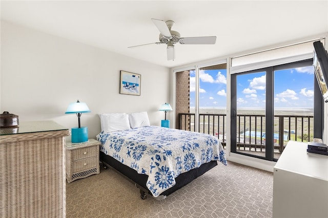 bedroom with ceiling fan, carpet flooring, and access to outside