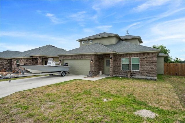 view of front of home with a front lawn and a garage