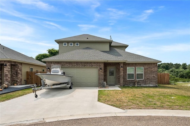 view of front of property featuring a front yard and a garage