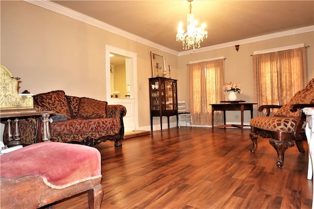 sitting room with a notable chandelier, hardwood / wood-style flooring, and crown molding