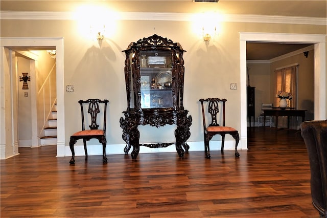 interior space with dark hardwood / wood-style floors and crown molding