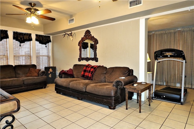 living room with light tile patterned floors and ceiling fan