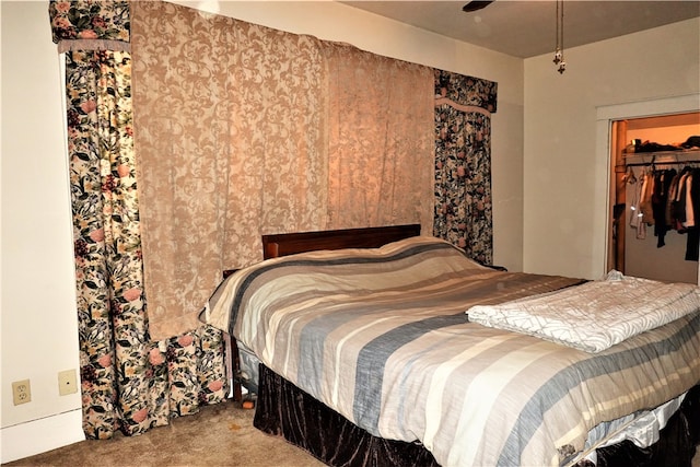 bedroom with a closet, a walk in closet, ceiling fan, and carpet floors