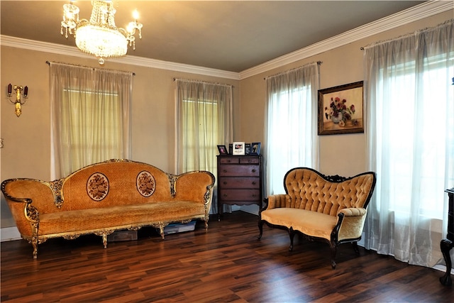 sitting room with dark hardwood / wood-style flooring, a notable chandelier, and ornamental molding