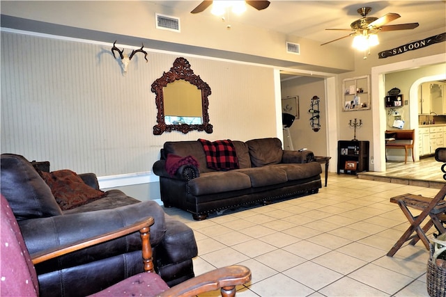 living room featuring ceiling fan and light tile patterned floors