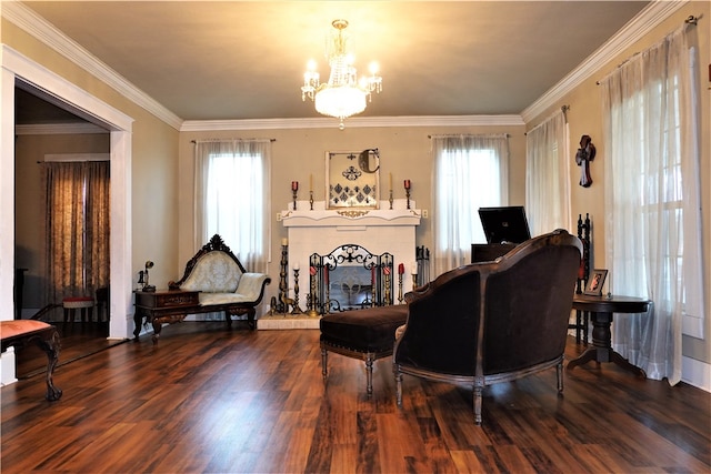 sitting room featuring an inviting chandelier, hardwood / wood-style flooring, and ornamental molding