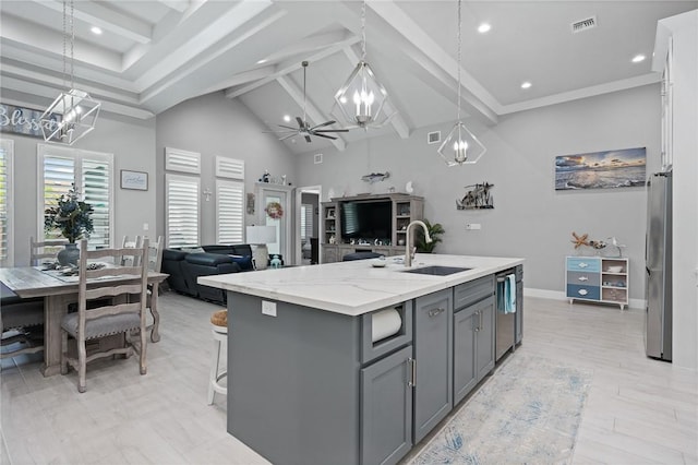 15509 Finistere St, Corpus Christi, TX 78418 - kitchen featuring high vaulted ceiling, gray cabinets, a sink, appliances with stainless steel finishes, and open floor plan