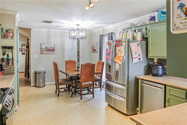 kitchen featuring green cabinets, an inviting chandelier, appliances with stainless steel finishes, and ornamental molding