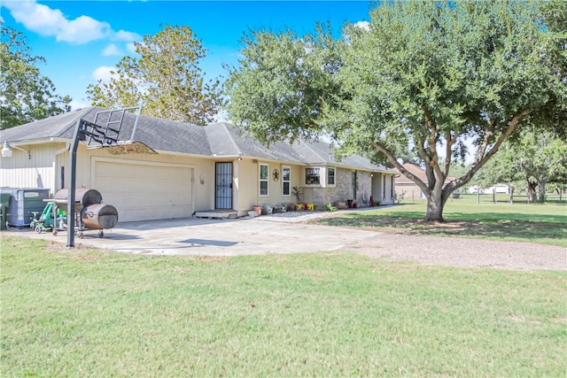 ranch-style house with a garage and a front lawn