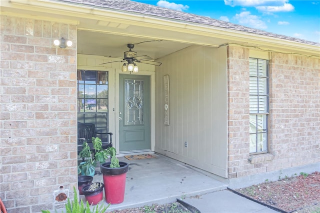 entrance to property with ceiling fan