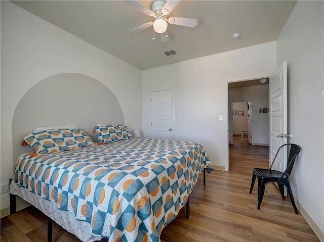 bedroom featuring hardwood / wood-style flooring and ceiling fan