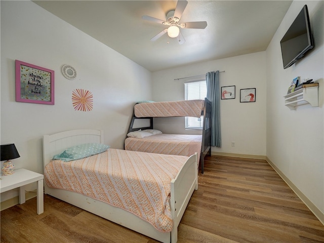 bedroom with hardwood / wood-style flooring and ceiling fan