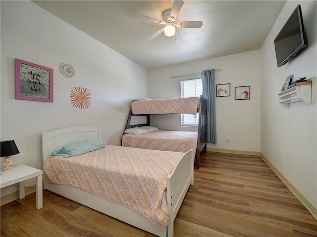 15017 Beach Walk Loop, Corpus Christi, TX 78418 - bedroom with wood finished floors, ceiling fan, and baseboards