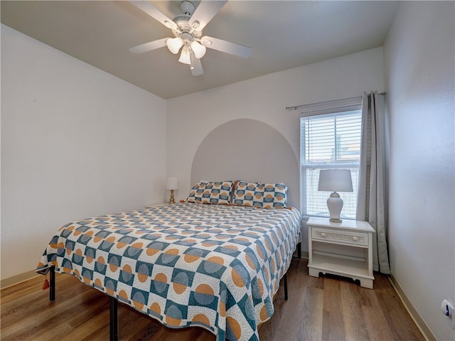 bedroom with wood-type flooring and ceiling fan