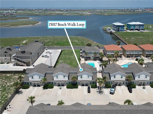 15017 Beach Walk Loop, Corpus Christi, TX 78418 - aerial view of residential area featuring a nearby body of water and a pool area