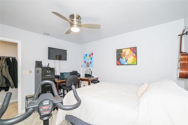205 S 2nd St, Rockport, TX 78382 - bedroom with ceiling fan, an office area, a spacious closet, and baseboards
