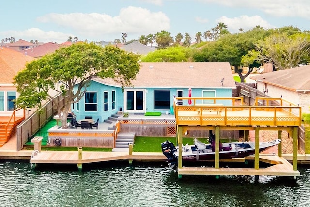 15010 Tesoro Dr, Corpus Christi, TX 78418 - rear view of property featuring a deck with water view and a fenced backyard
