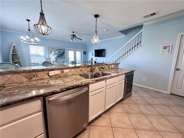 15006 Aruba Dr Unit A, Corpus Christi, TX 78418 - kitchen with dishwasher, ceiling fan, crown molding, decorative light fixtures, and light tile patterned flooring