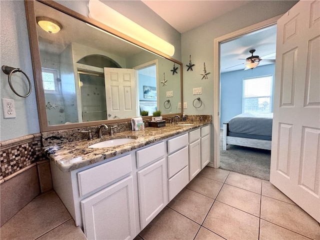 15006 Aruba Dr Unit A, Corpus Christi, TX 78418 - ensuite bathroom featuring double vanity, tile patterned floors, ceiling fan, and a shower