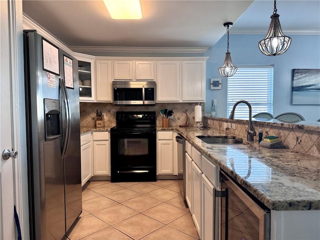 15006 Aruba Dr Unit A, Corpus Christi, TX 78418 - kitchen with stainless steel appliances, beverage cooler, backsplash, a peninsula, and light tile patterned floors