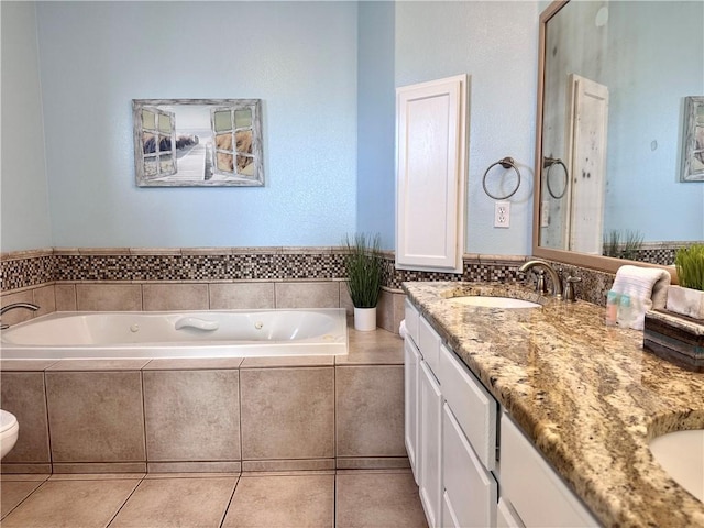 15006 Aruba Dr Unit A, Corpus Christi, TX 78418 - bathroom with double vanity, a garden tub, and tile patterned flooring